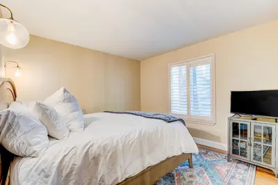 a bedroom with a bed and a flat screen tv at Incline Village Charmer in Incline Village