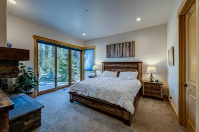 a bedroom with a bed and a large window at Sierra Vista in Truckee
