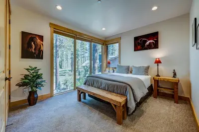 a bedroom with a bed and a large window at Sierra Vista in Truckee