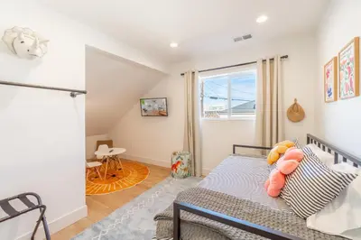 a bedroom with a bed and a window at Luxury 4-bed home in Riverside Heights! in Reno