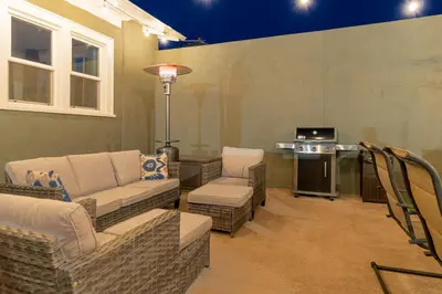 a living room with couches and chairs and a table at Luxury 4-bed home in Riverside Heights! in Reno