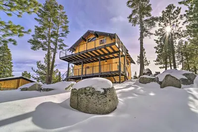 a wooden house in the snow with snow covered trees at 4 Mi to Slopes! Hot Tub Haven with Lake Tahoe Views in Incline Village