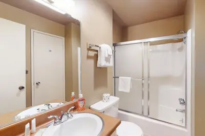 a bathroom with a shower and a sink and a toilet at Sherwin Villas 12 B in Mammoth Lakes
