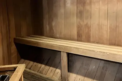 a wooden bench sitting inside of a wooden wall at Sherwin Villas 12 B in Mammoth Lakes