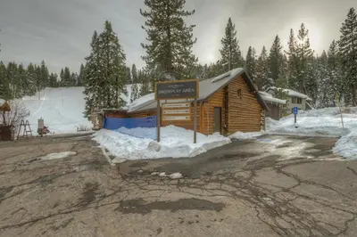 a sign in front of a building in the snow at Granlibakken Gem - Unit 71 in Tahoe City