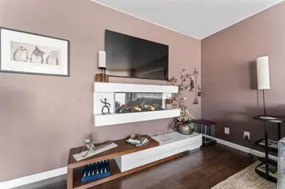 a living room with a fish tank on a wall at Panorama Place in Reno