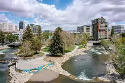 a view of a river in a city with buildings at Panorama Place in Reno