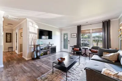 a living room with a couch and a table at Reno Roost in Reno