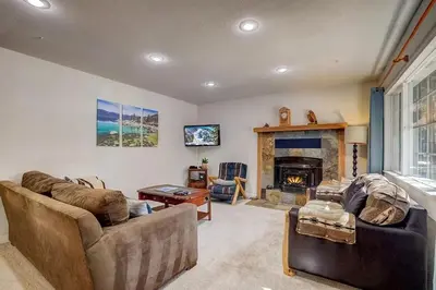 a living room with two couches and a fireplace at 1763 Saponi Street home in South Lake Tahoe