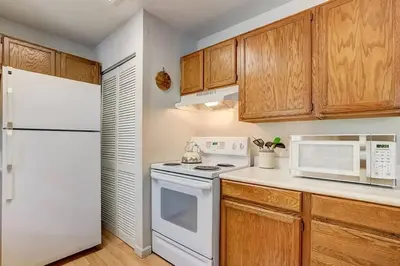 a kitchen with white appliances and wooden cabinets at 1763 Saponi Street home in South Lake Tahoe