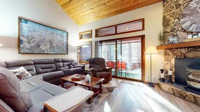 a living room with a couch and a fireplace at Winterset #3 condo in Mammoth Lakes
