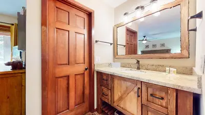 a bathroom with a sink and a mirror at Winterset #3 condo in Mammoth Lakes