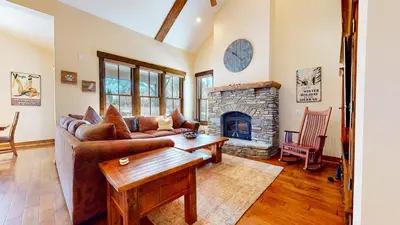 a living room with a couch and a fireplace at Snowcreek VI The Lodges #1167 condo in Mammoth Lakes