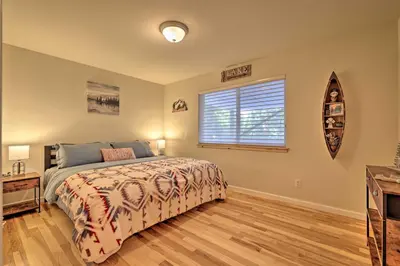 a bedroom with a bed and a window at Cold Springs Mountain Cabin Hot Tub and Generator in Cold Springs