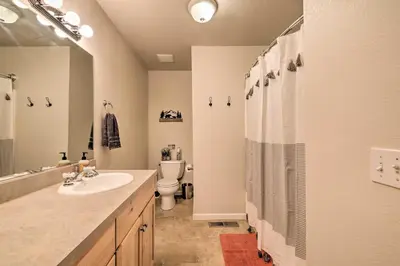 a bathroom with a sink and a toilet and a shower at Cold Springs Mountain Cabin Hot Tub and Generator in Cold Springs