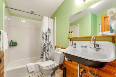 a bathroom with a sink and a toilet at Cabin in Soda Springs in Soda Springs
