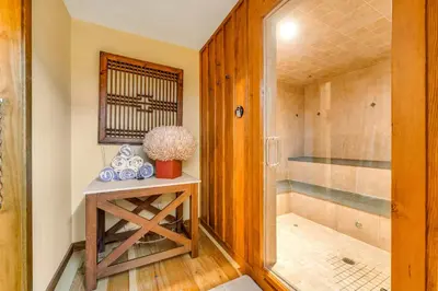 a bathroom with a shower and a table with a sink at Cabin in Soda Springs in Soda Springs
