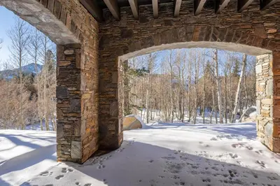 an archway in a brick building in the snow at Creekhouse 1553 in Mammoth Lakes