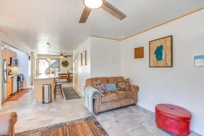 a living room with a couch and a kitchen at 2 Mi to Heavenly Mtn Resort Retreat with Sauna! in Stateline