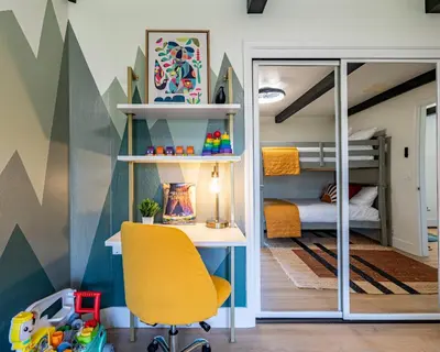 a yellow chair in a room with a bunk bed at Secluded Mtn Top Family Haven w/Views Spa & Arcade in Three Rivers