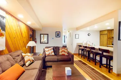 a living room with a couch and a table at Horizons 4 179 in Mammoth Lakes