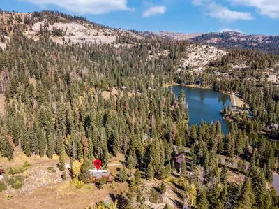 an aerial view of a lake and a red cross at Walk to the Lake - Ski in out Amazing 5 Bdrm - VH#343 in Bear Valley