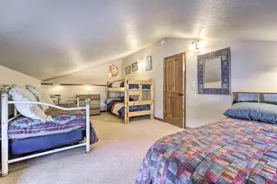 a bedroom with two beds and a bunk bed at Shuttle to Ski Resort Northstar Home! in Truckee