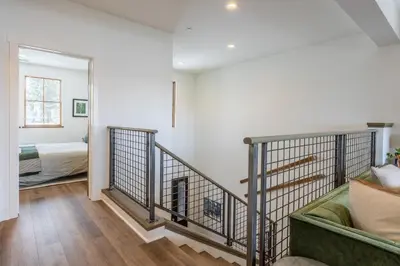 a living room with a couch and a bedroom at Newly Built Updated 3 Bed 2 and a half bath Creekhouse at Snowcrk Resort 1463 Amazing Mountain Views in Mammoth Lakes
