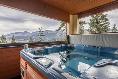 a blue tub in a room with a window at Bridges 112 in Mammoth Lakes