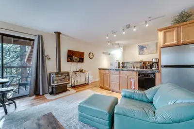 a living room with a couch and a kitchen at Less Than 3 Mi to Lake Tahoe Incline Village Condo! in Incline Village