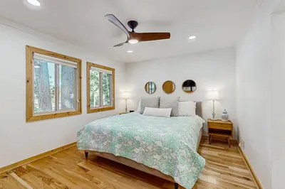 a bedroom with a bed and a ceiling fan at Retreat at Oriole Way in Incline Village