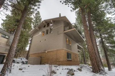 a house in the woods in the snow at Retreat at Oriole Way in Incline Village
