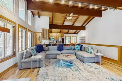 a living room with a couch and a table at Retreat at Oriole Way in Incline Village