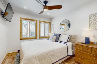 a bedroom with a bed and a ceiling fan at Retreat at Oriole Way in Incline Village