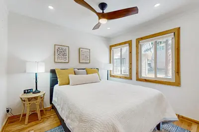 a bedroom with a bed and a ceiling fan at Retreat at Oriole Way in Incline Village