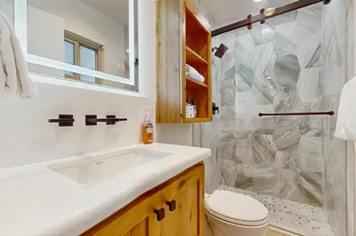a bathroom with a sink and a shower at Retreat at Oriole Way in Incline Village
