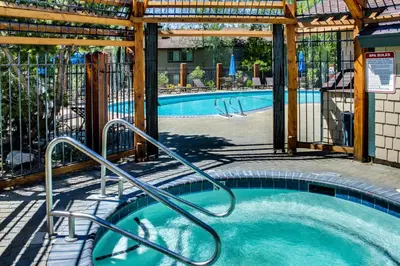 a swimming pool with a hot tub in a building at Lake Forest Drive Retreat in Tahoe City
