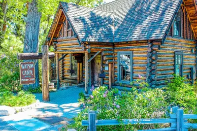 a log cabin with a sign in front of it at Lake Forest Drive Retreat in Tahoe City