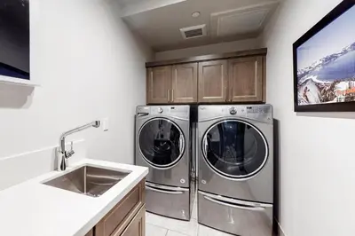a kitchen with two washing machines and a sink at Gondola Vista Luxury Villas by Ski Heavenly & Beaches in South Lake Tahoe