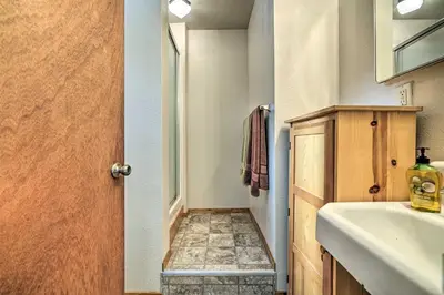 a small bathroom with a sink and a mirror at 7 Mi to Yosemite Natl Park Riverfront Getaway! in Groveland