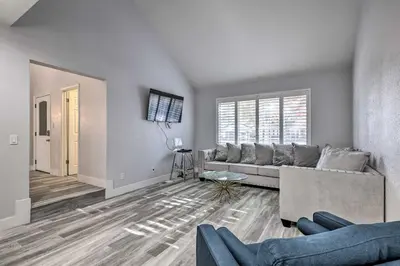 a living room with a couch and a table at Modesto Home with Deck - 2 Mi to Vintage Faire Mall in Modesto