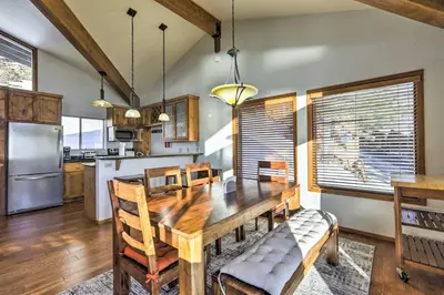 a kitchen and dining room with a wooden table at Steps to Diamond Peak Incline Village Condo in Incline Village