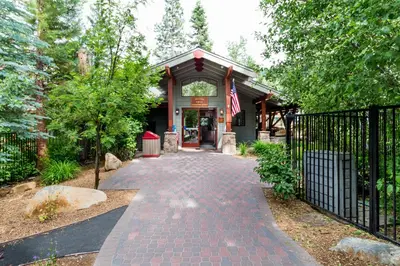 a house with a gate and a brick walkway at Northstar's Cozy Condo in Truckee