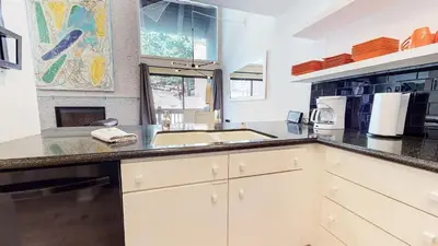 a kitchen with a sink and a counter top at Walk to Canyon Lodge! Ski back! Modern Space in Mammoth Lakes