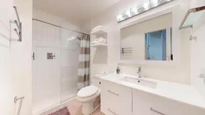 a bathroom with a sink and a toilet and a shower at Walk to Canyon Lodge! Ski back! Modern Space in Mammoth Lakes