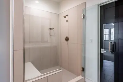 a bathroom with a shower with a glass door at Creekhouse 1551 in Mammoth Lakes