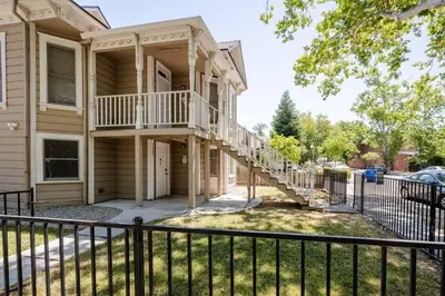 a house with a balcony and a fence at *2bdr Victorian Home away from Home - *Central Loc in Sacramento