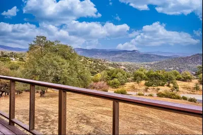 a balcony with a view of the mountains at NEW! Yosemite Mountain villa, stunning views -more in Oakhurst