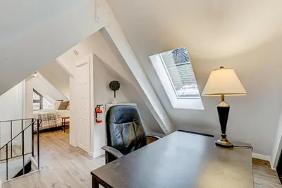 a room with a table and a chair and a lamp at Crystal Bay Comfort in Incline Village
