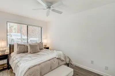 a white bedroom with a bed and a window at Crystal Bay Comfort in Incline Village